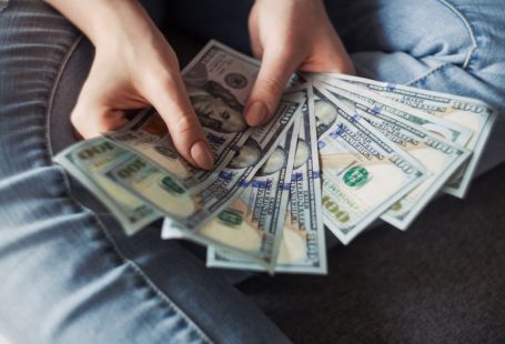 Financial Independence - fan of 100 U.S. dollar banknotes