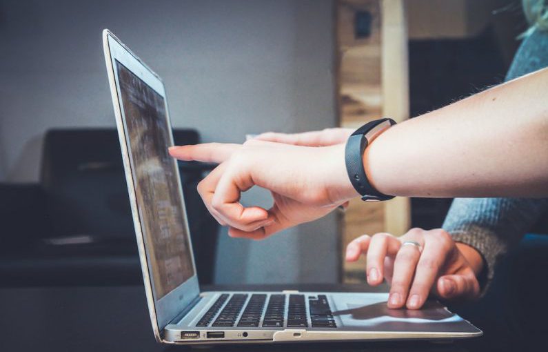 Negotiation Handshake - person using laptop