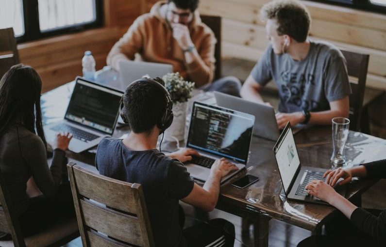Business Expansion - group of people using laptop computer