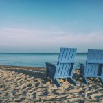 Retirement Planning - two blue beach chairs near body of water
