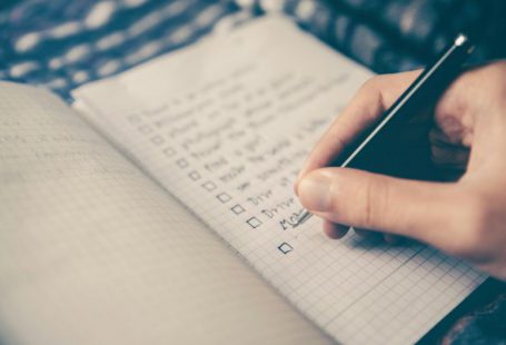 Estate Planning - person writing bucket list on book
