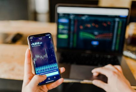 Income Streams - person using phone and laptop computer