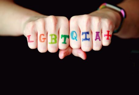 Portfolios Diversity - person with blue and red manicure