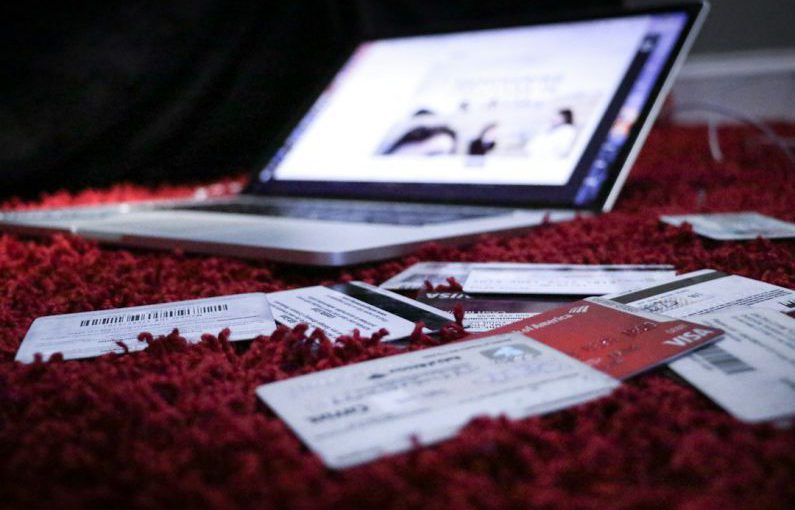 Credit Score - white printer paper on red textile