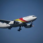 Peer-to-peer Lending - a large jetliner flying through a blue sky
