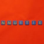Annuities - Close-Up Shot of Text on a Red Surface
