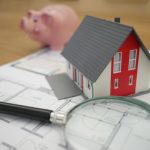 Emergency Fund - white and red wooden house beside grey framed magnifying glass