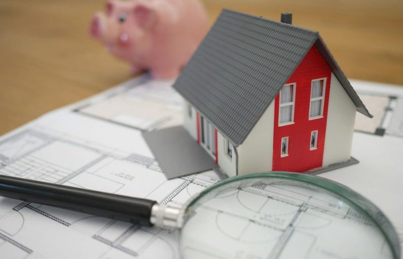 Emergency Fund - white and red wooden house beside grey framed magnifying glass