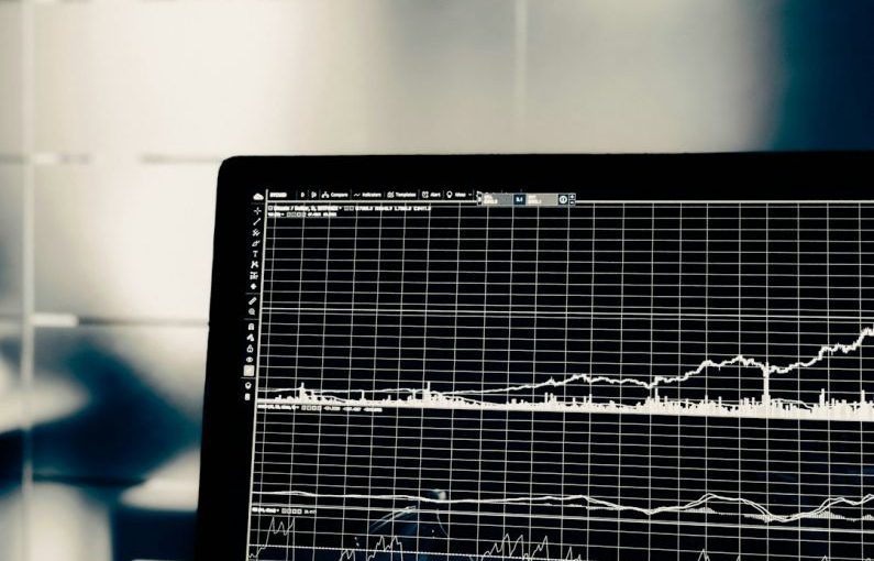Stock Market Graphs - turned on flat screen monitor