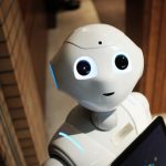 Blockchain Future - white robot near brown wall