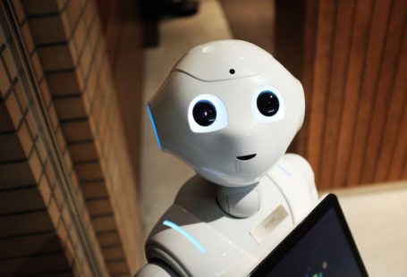 Blockchain Future - white robot near brown wall