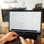Stocks Bonds Scale - person using MacBook pro