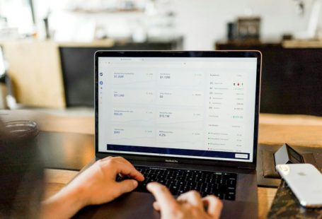 Stocks Bonds Scale - person using MacBook pro