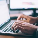 Technology Stocks - person using MacBook Pro