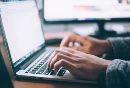 Technology Stocks - person using MacBook Pro