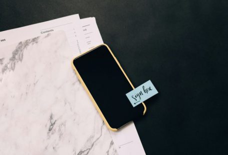 Tax Documents - black smartphone on white pad