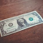 Compound Interest - 1 US dollar banknote close-up photography