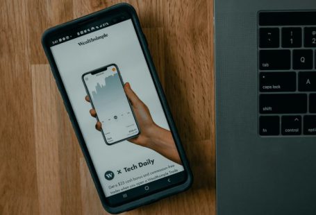 Derivatives Market - black samsung android smartphone on brown wooden table