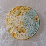 Market Volatility - a dirty round object sitting on a white surface