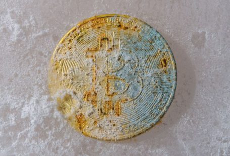 Market Volatility - a dirty round object sitting on a white surface