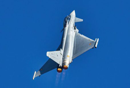 Peer-to-peer Lending - a silver fighter jet flying through a blue sky