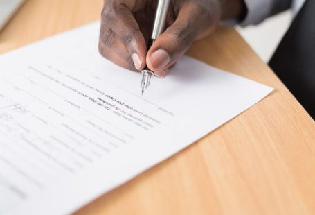 Legal Documents - person writing on white paper