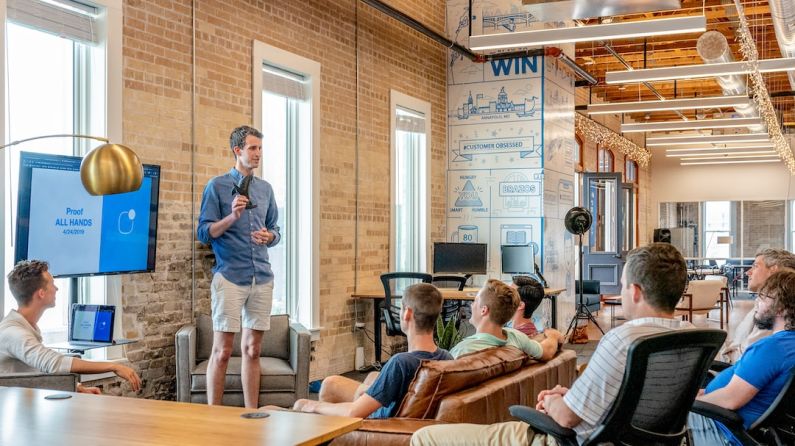 Business Models - man standing in front of group of men