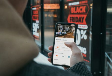 E-commerce Shopping - person holding black samsung android smartphone