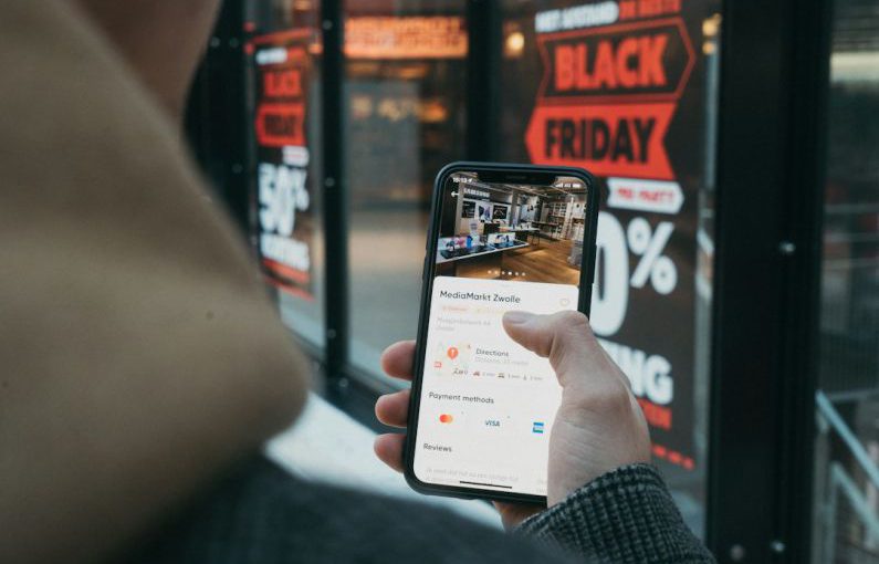 E-commerce Shopping - person holding black samsung android smartphone